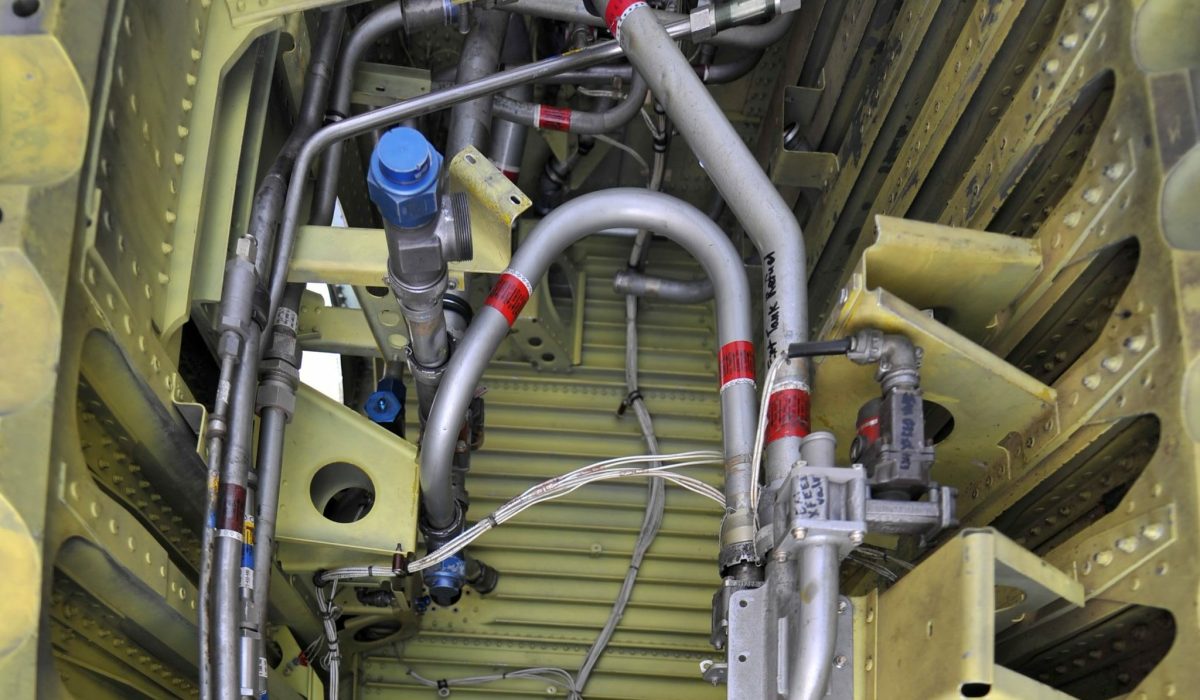 LITTLE ROCK AIR FORCE BASE, Ark. -- Airman 1st Class James Trainer, 19th Component Maintenance Squadron aircraft fuels systems repair apprentice, tightens a fuel pipe on a C-130 aircraft training wing, July 16, on base. The majority of an aircraft fuels systems repair Airman's duties take place in the wing of aircraft they maintain. (U.S. Air Force photo by Senior Airman Steele C. G. Britton)